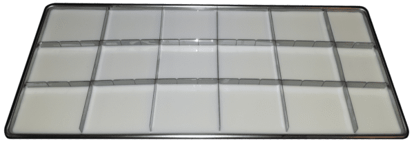 A white tray with many rows of glass.