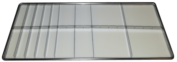 A white tray with many compartments on top of it.