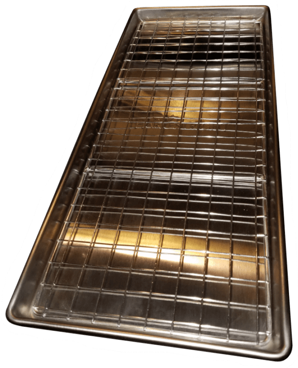 A metal tray with gold colored grates on it.