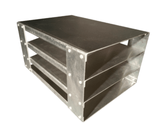 A metal box with three levels on top of it.