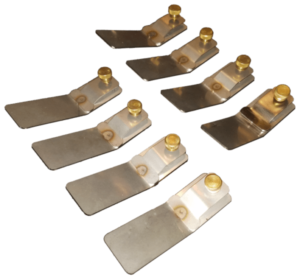 A set of eight brass and steel plates.