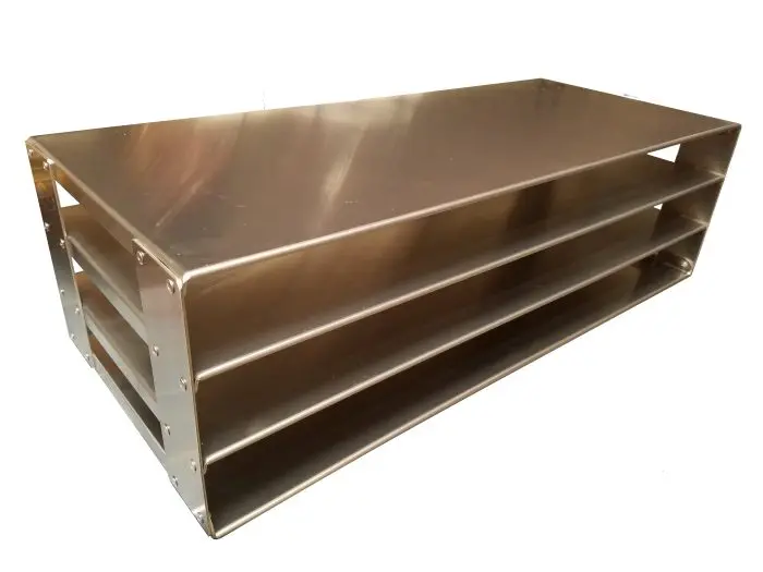 A metal shelf with three levels sitting on top of it.