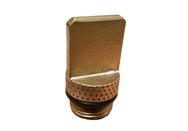 A gold colored metal container with a black lid.