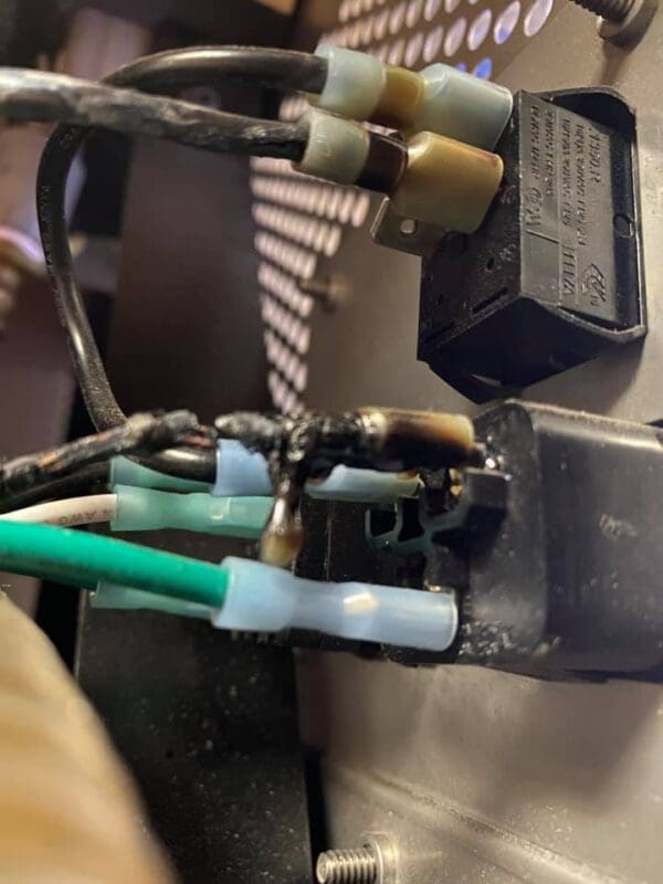 A close up of wires and wires plugged into an electrical device.