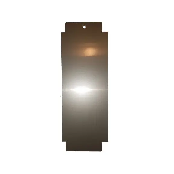 A mirror with a light reflecting off it.