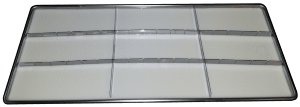 A white tray with many rows of glass.