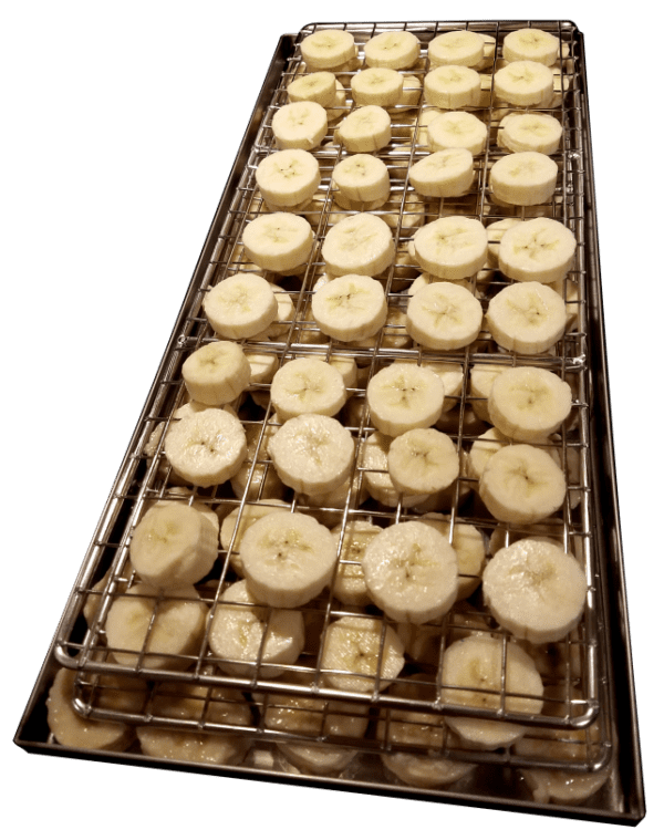 A tray of sliced bananas on top of a rack.